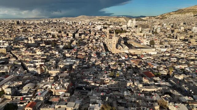 aerial drone view of the minarets and courtyard of the Umayyad Mosque in Damascus, Syria