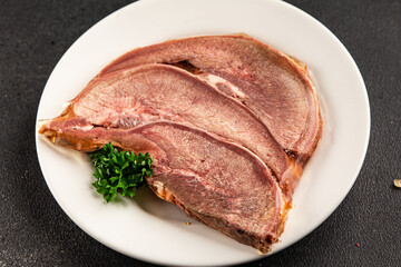 Fototapeta premium Tongue food pork meat cold appetizer food preparation tasty snack fresh delicious gourmet food background on the table rustic food top view copy space