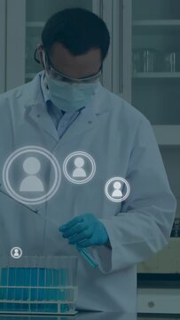 Vertical video: Lab tech starting pipette transfer in lab, avatars around hands and rack tracking