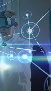 Lead researcher placing VR headset extending hand tapping nodes, visualizing data for research