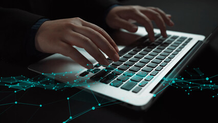 Naklejka premium Hands typing on a laptop keyboard are depicted with abstract digital network overlays, symbolizing technology, communication, and modern work environments. Xenic