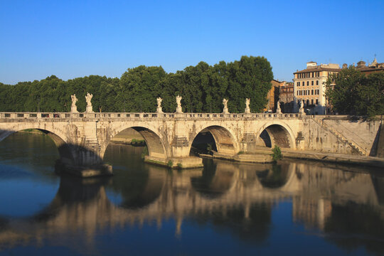 Ponte Sant'Angelo and reflections on the Tiber River in Rome