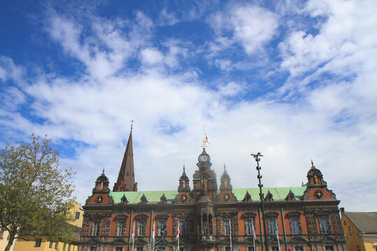Malmo Town Hall (Radhuset) and St. Peter's Church under a cloudy sky