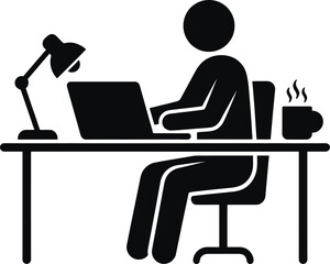 Person sitting at desk working on laptop with lamp and coffee cup