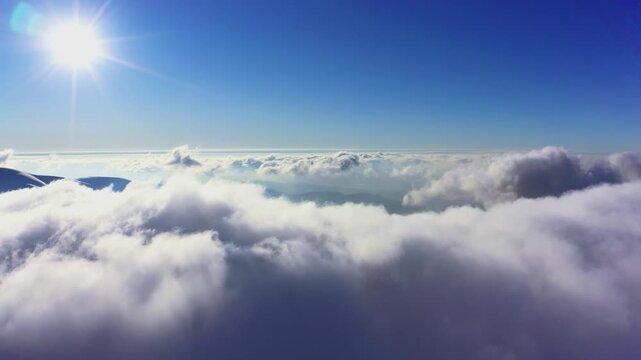 Wonderful view of extraordinary cloudy valley and bright orange sunset