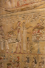 Ancient Egyptian Hieroglyphs and Relief Carvings on Stone Wall