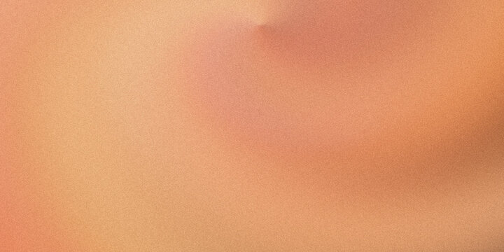 A blurry image with orange and pink hues in the background