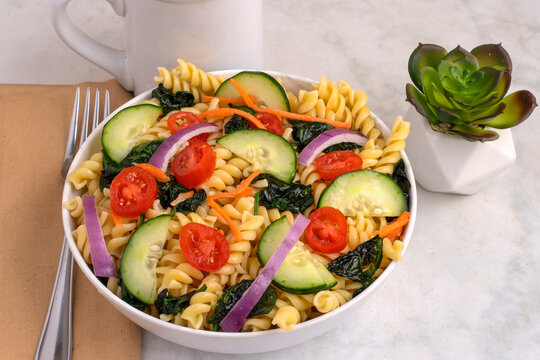 rotini pasta salad  with  tomatoes and cucumbers
