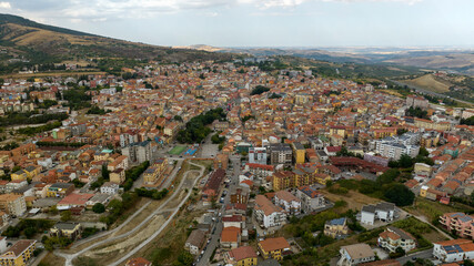 Obraz premium Aerial view of the city of Rionero in Vulture, located in the province of Potenza, Basilicata, Italy. Panorama of a dense cluster of historic buildings with the sky in background.