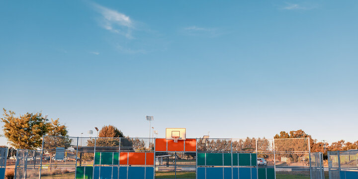 Wide angle basketball backboard with blue sky background