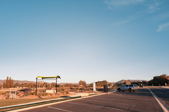Cars parked in regional New South Wales sporting complex under blue sky