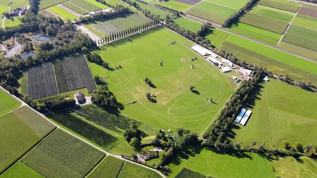 High altitude overview of equestrian arena complex and fields