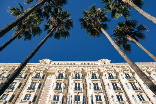 Cannes, France - September 15, 2025: facade of the Carlton Cannes luxury hotel with palm trees on Boulevard de la Croisette on the French Riviera