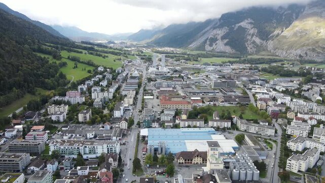 Rising panorama over Chur industrial valley and towers