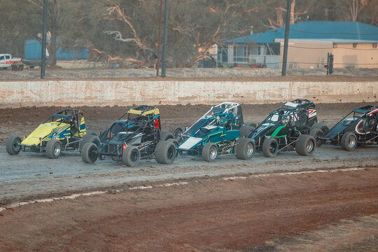 Sprint cars warming up getting ready to race at the speedway