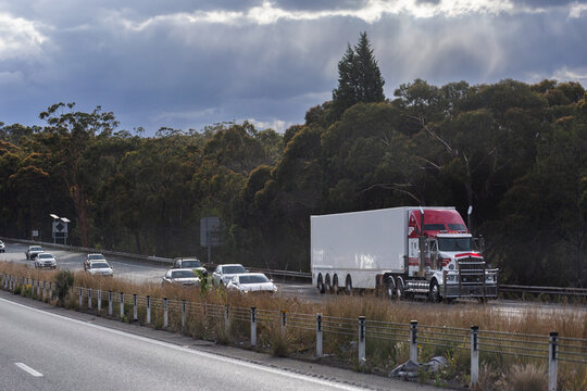 truck traveling in left lane on divided highway road in NSW Australia