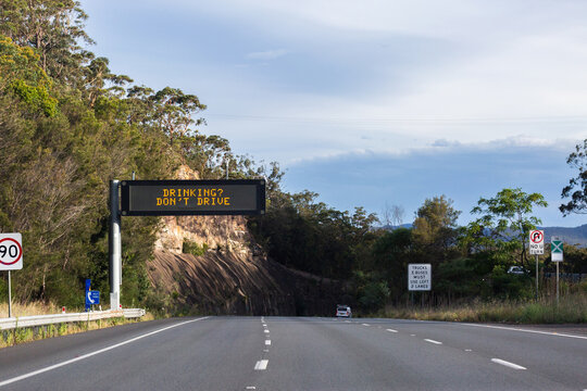 Drinking? Don&rsquo;t drive warning notice text on overhead digital sign above road in NSW Australia