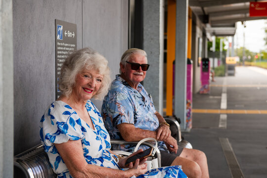 senior couple waiting at the train station