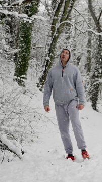 Individual Performing Balance Exercises In Snow. Person Focusing On Control During Wintertime Stability Routine. Man Engaging In Stability Training On Snowy Terrain With Cautious Movements