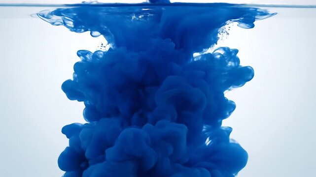 Blue Ink Cloud Dissolving in Clear Water Abstract Motion.