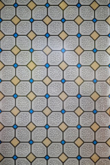 Geometric mosaic tile pattern with octagons and blue accents