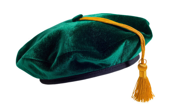 Isolated green velvet academic doctoral tam with a golden tassel for graduation ceremony