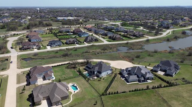 Wooded edge residential arc in Wellington of Flower Mound area borders dense tree stands, large estate homes and nearby upscale neighborhood amenities. Vary rooflines, trimmed lawns in Texas