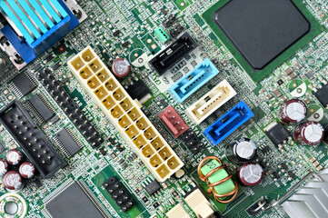 Close-up view of a complex computer motherboard with various electronic components and connectors