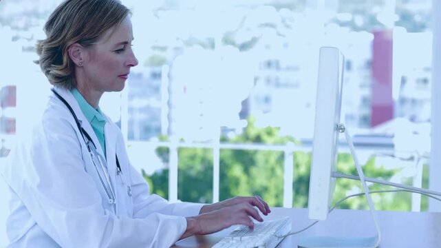 Animation of red pattern over caucasian female doctor using computer