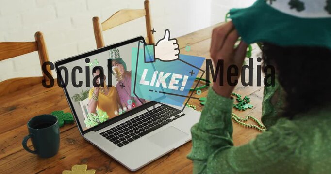 Animation of online digital icons over businesswoman using laptop