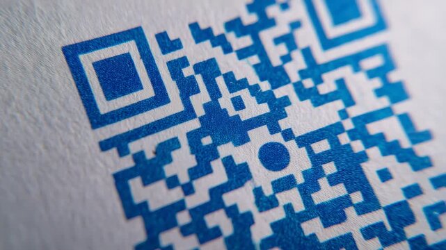 Macro of QR code printed on paper, ink texture visible, modern cashless payment and digital access theme