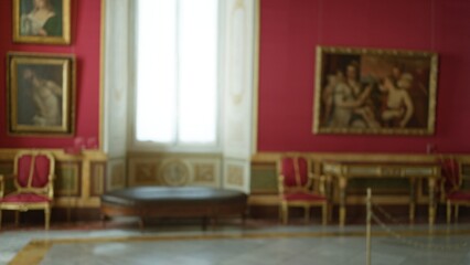 Blurred museum interior with soft bokeh and defocused paintings, chairs and ornate console by a bright window and marble floor  background backplate copyspace. © Krakenimages.com
