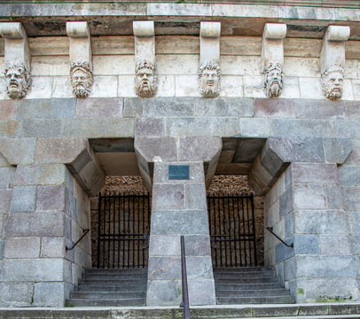 Ancient Stone Entrance with Carved Mascarons