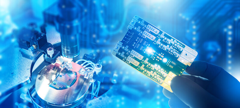 Semiconductor manufacturing and microelectronics engineering. Technician holds printed circuit board near wafer processing equipment, developing microchips and advanced electronic components.