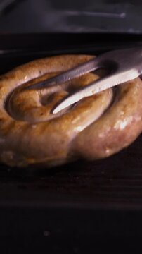 Juicy sausages grilled on the grill.