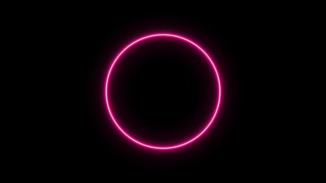 Glowing neon pink circle on black frame