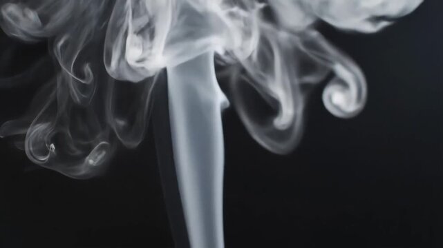 Abstract Smoke Swirls and Wisps Against a Dark Background 1.