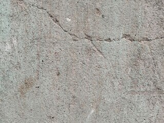 Obraz premium Close up of cracked concrete surface with rough texture and small imperfections image photo