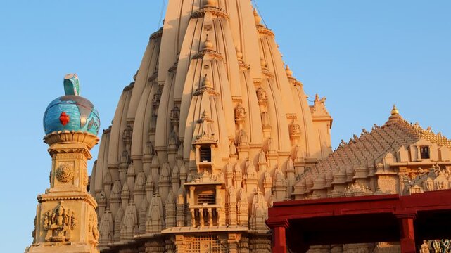 majestic somnath temple shikhara rising against clear blue sky at dawn