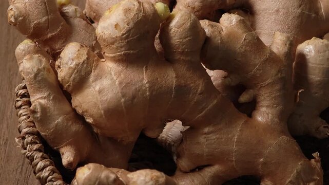 Fresh ginger in a wooden plate.	
