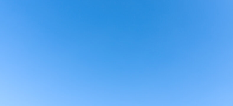 Low angle view and full frame of beautiful light blue sky without clouds in the afternoon on sunny day used as natural background texture in decorative art work