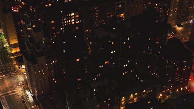 View of buildings and city lights at night in New York, USA