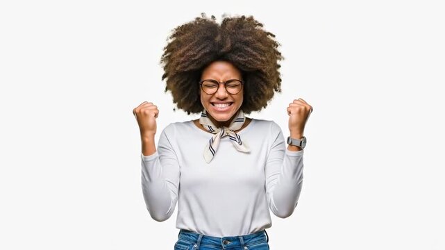 A young woman with a big afro hairstyle smiling and looking happy