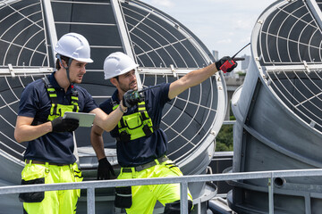 Professional Worker Teamwork Servicing HVAC building cooling tower, Industry air conditioner service © Quality Stock Arts