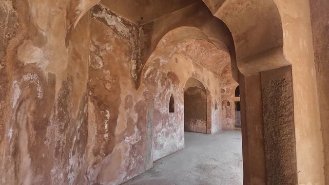 Symmetrical stone corridors and arched galleries inside the historic Gol Bawdi stepwell.
Capturing the magnificent architectural depth and ancient water conservation system of Farrukh Siyar's reign