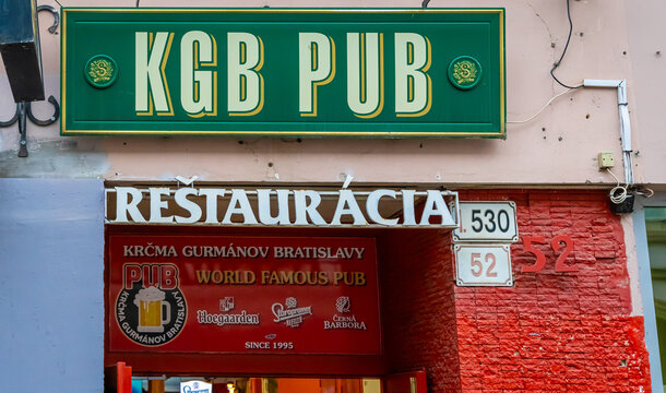 KGB Pub Bratislava entrance with signage and red brick street facade view