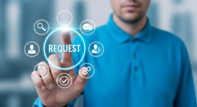 A man in a blue shirt is touching a request button with his finger