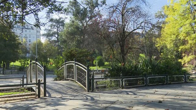 Urban park in Bilbao with gardens, fountains, trees, pergolas, and monuments. Green public space offering a peaceful environment where nature and city design meet.
