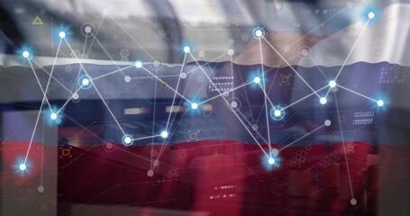 Typing mid adult male office worker in business attire using laptop at office, with network overlay © vectorfusionart