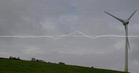 Fototapeta premium Rotating white wind turbine towering on sloping pasture, with dotted waveform overlay, copy space